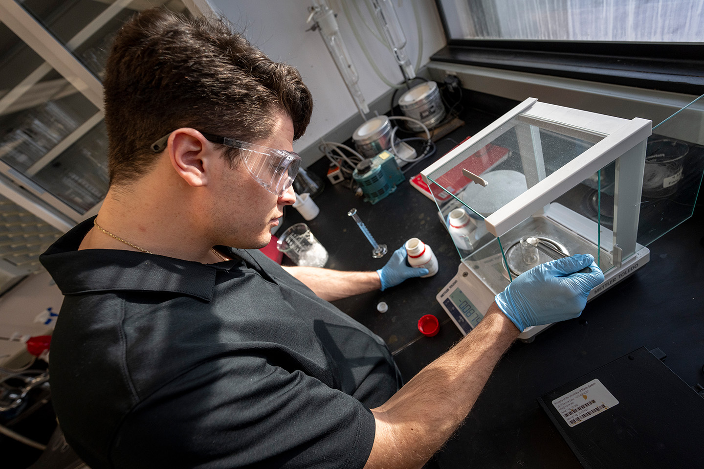 Chemical and Biomedical Engineering student working on a lab