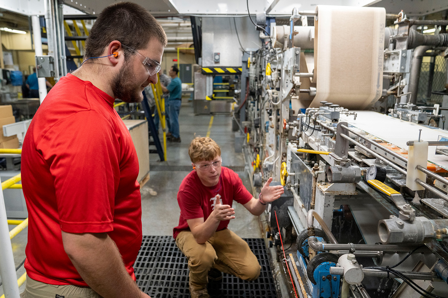 Chemical Engineering students working in a Paper Pilot Plant on paper production