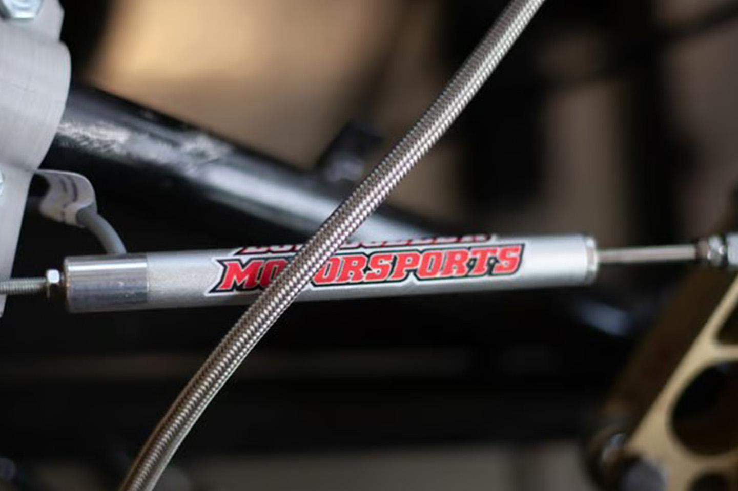 Motor Sports logo on a piece of a race car