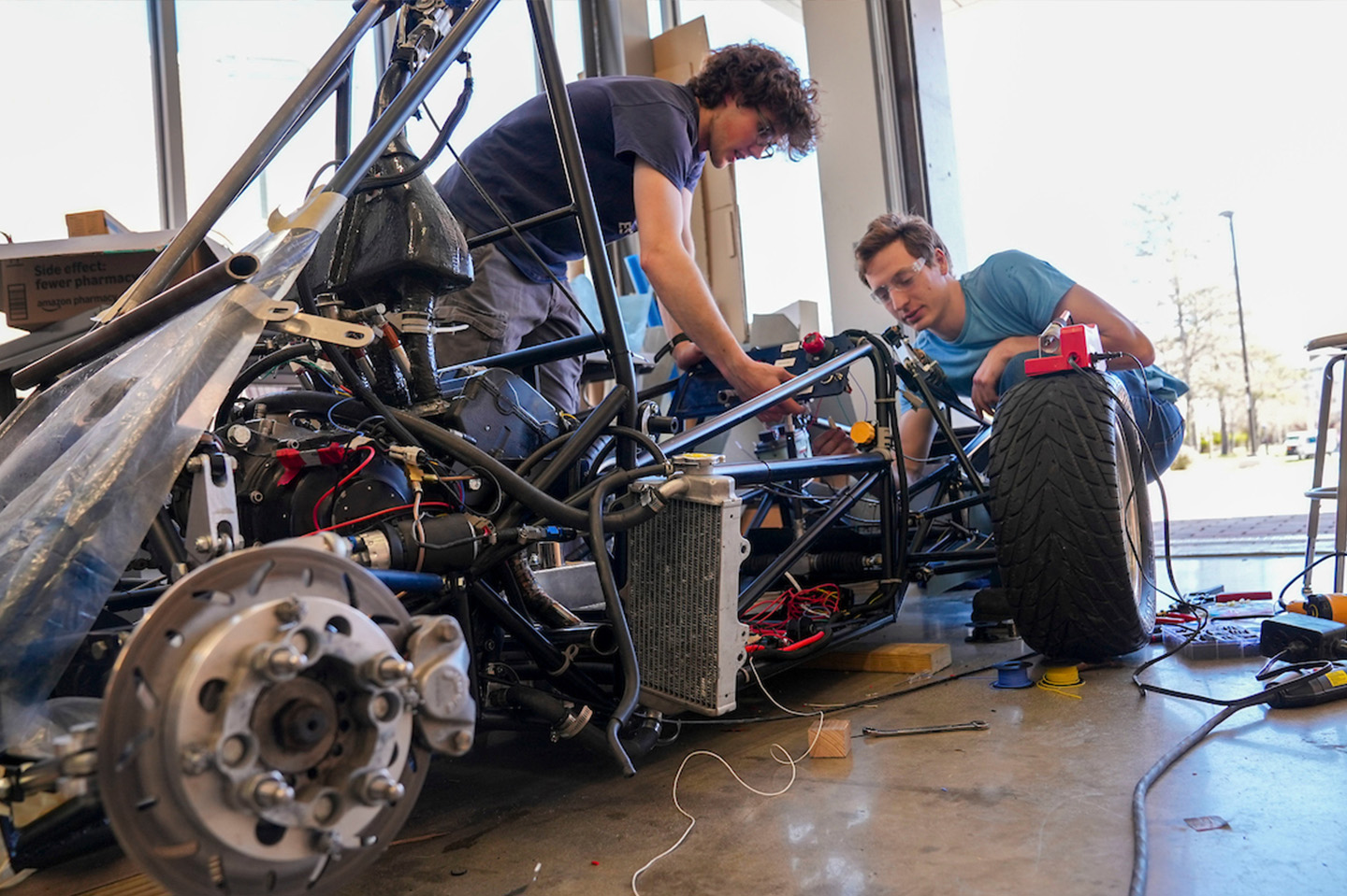 MCEC students working on a race car