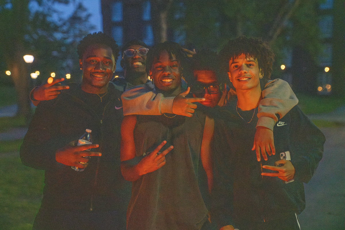 UMaine students posing together and smiling