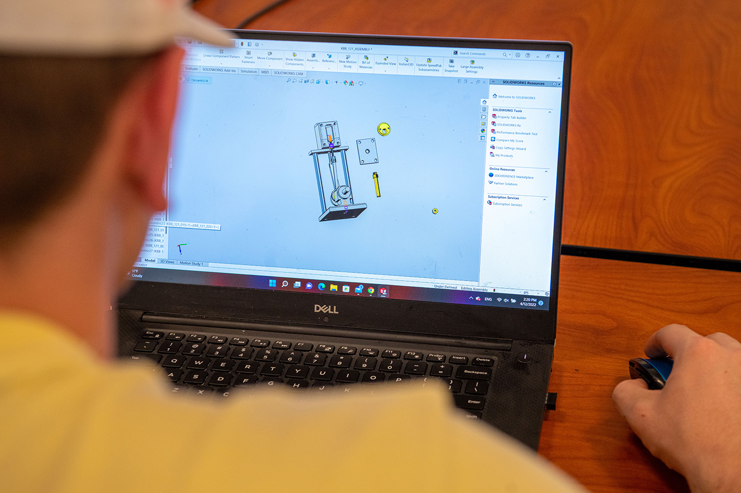 Mechanical Engineering Technology student working on their computer using engineering software to design
