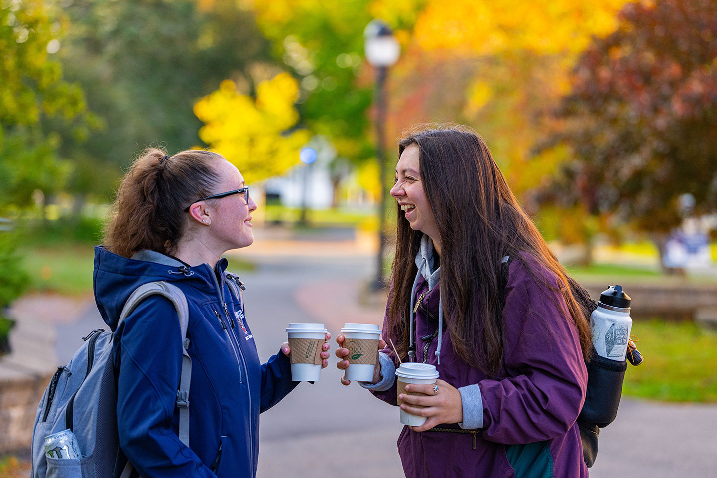 UMaine students getting coffee together and laughing