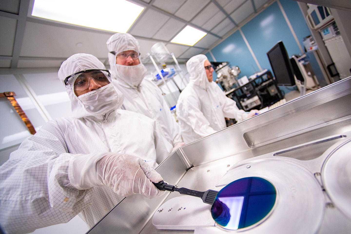 Engineers in a lab with lab suits on