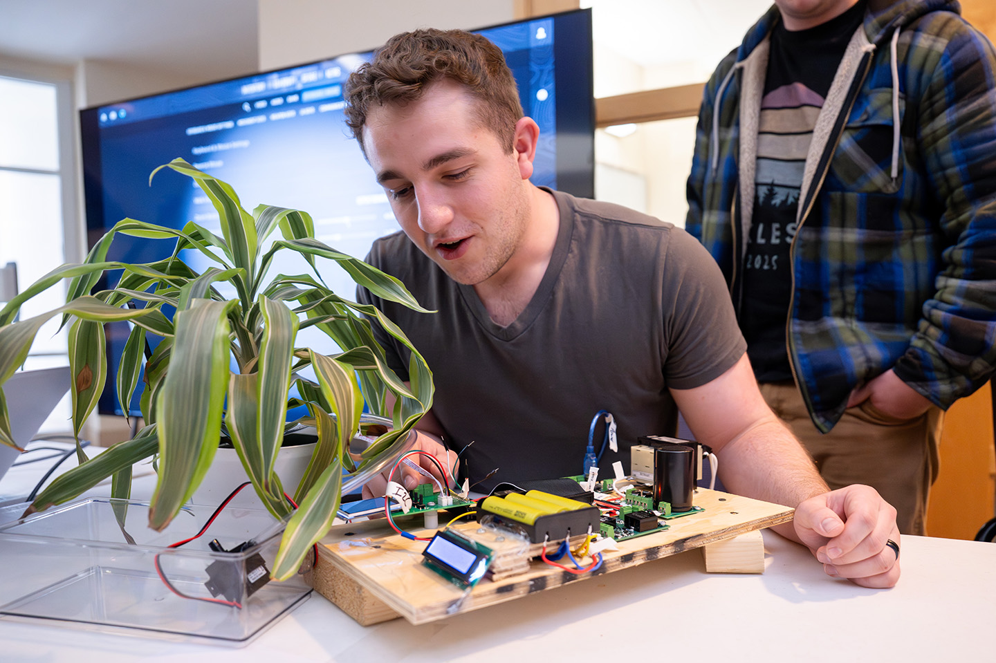 Engineering student working on a technology project in a classroom