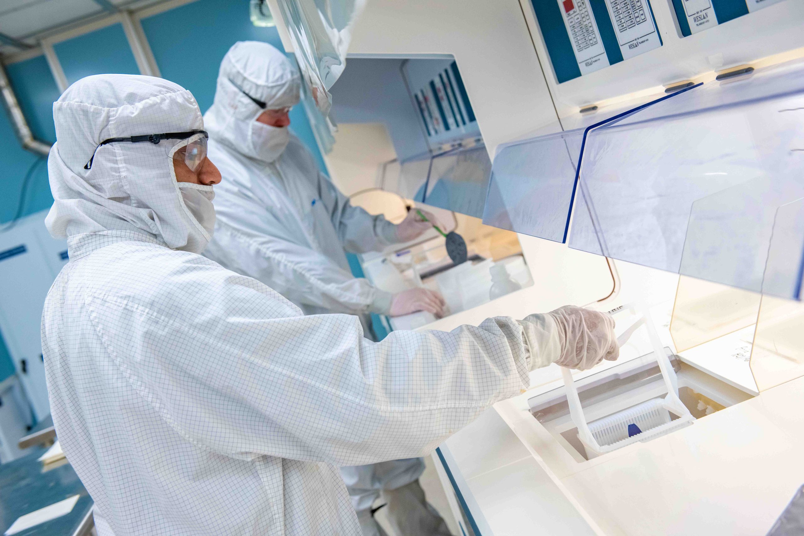 People working in a lab in lab suits