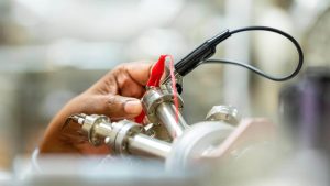 A photo of a hand and sensors in a lab