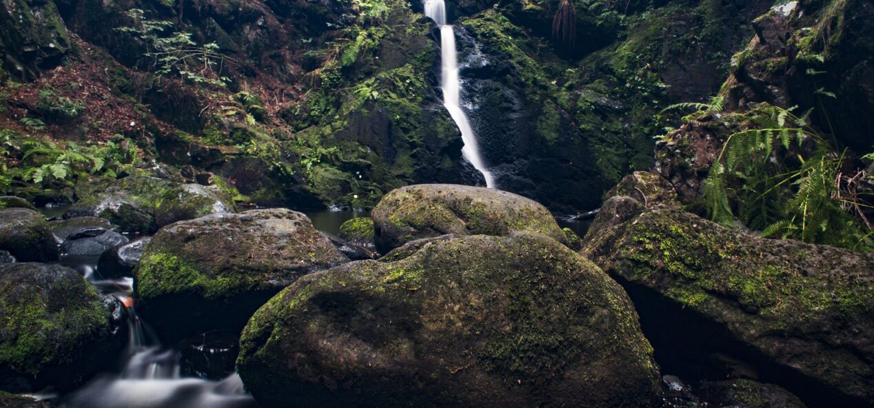 photo of waterfall over rocks