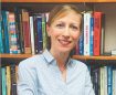 image of judith rosenbaum in front of a bookcase