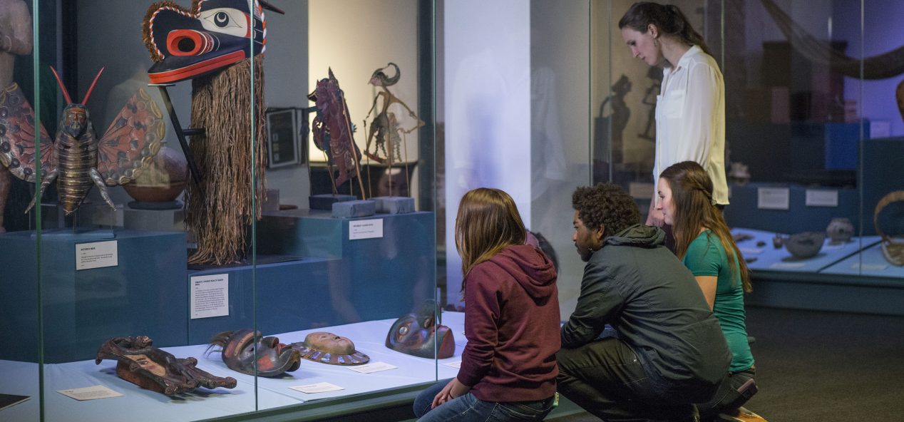 students viewing an exhibit at the hudson museum