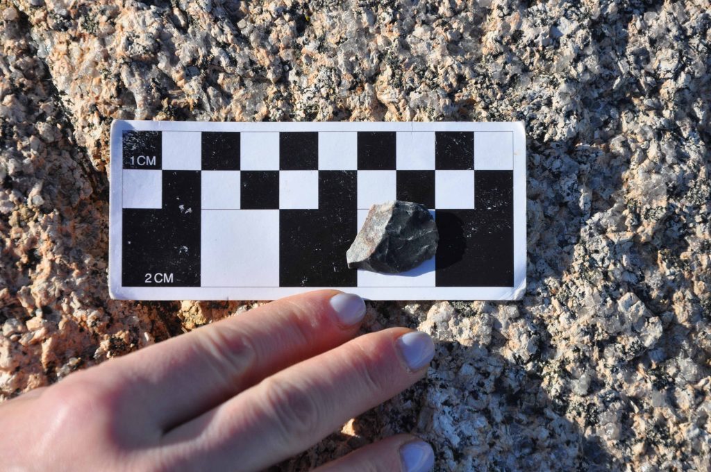 A chert scraper on a scale