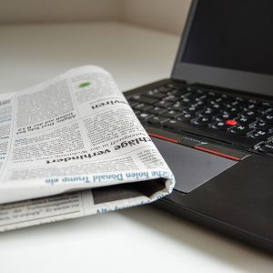 Newspaper and laptop