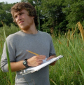 student taking notes in estuary