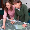 researchers with map