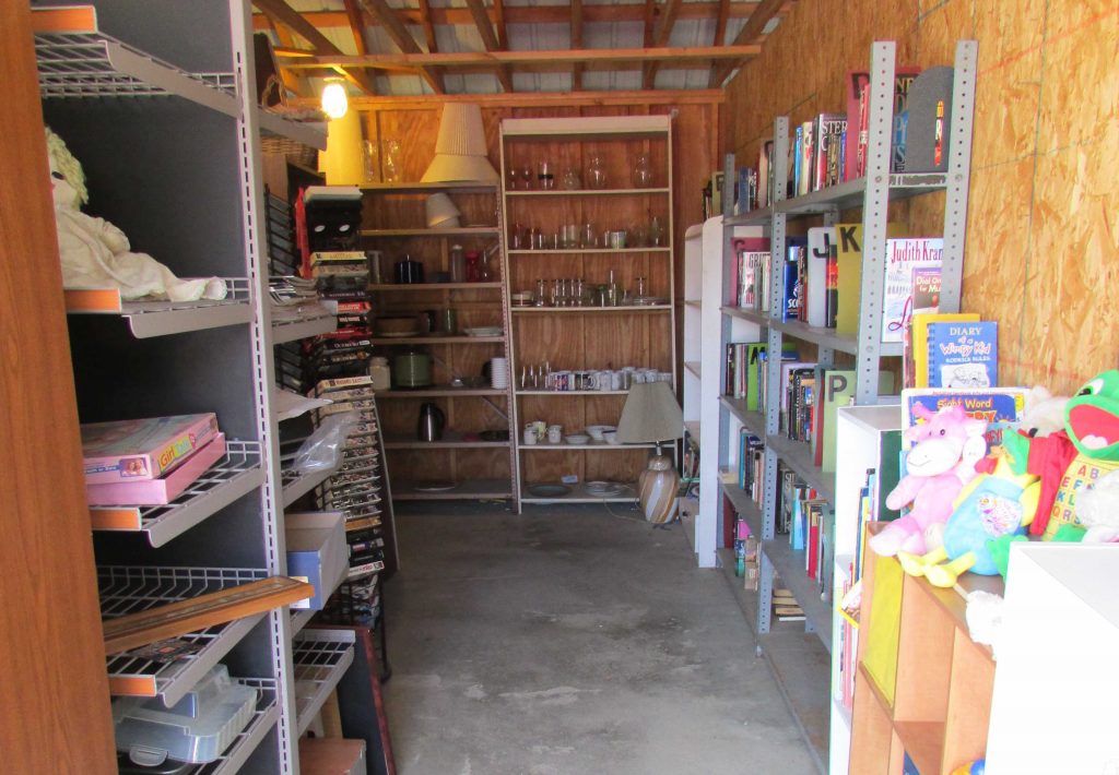 Image of swap shop interior with shelves full of items