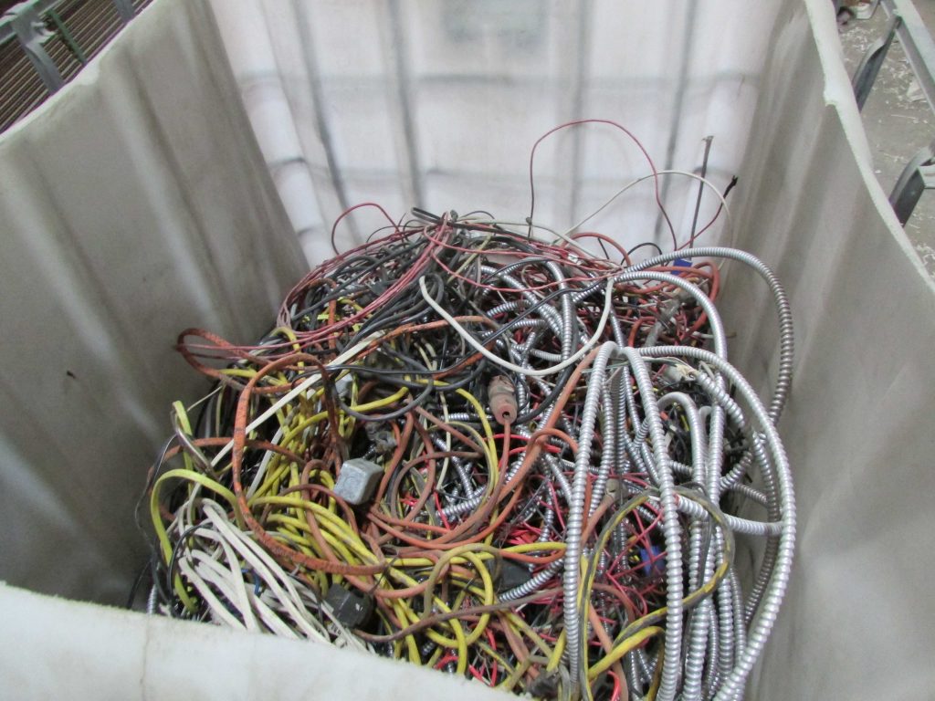 Image of tangled wires in container for recycling