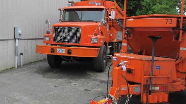 Image of orange garbage truck