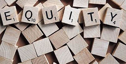 the word equity spelled out in scrabble letters