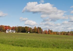 Farmhouse and field in autumn, Pittsfield, Maine