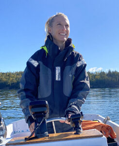 Lauren Ross at the helm of a boat