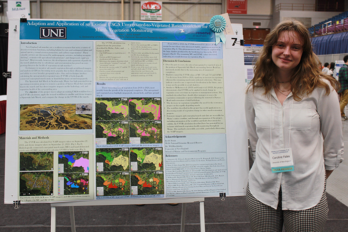 Caroline Fales with her undergraduate poster which received an honorable mention