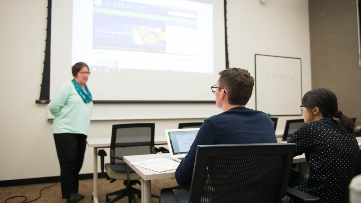 Professor lectures graduate students