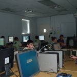 students learn in front of a computer