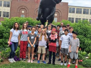 Group photo in front of the bear statue