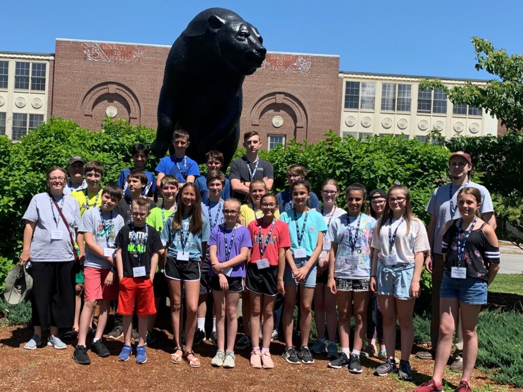 Image of 2019 participants in front of the black bear on the University of Maine Campus.