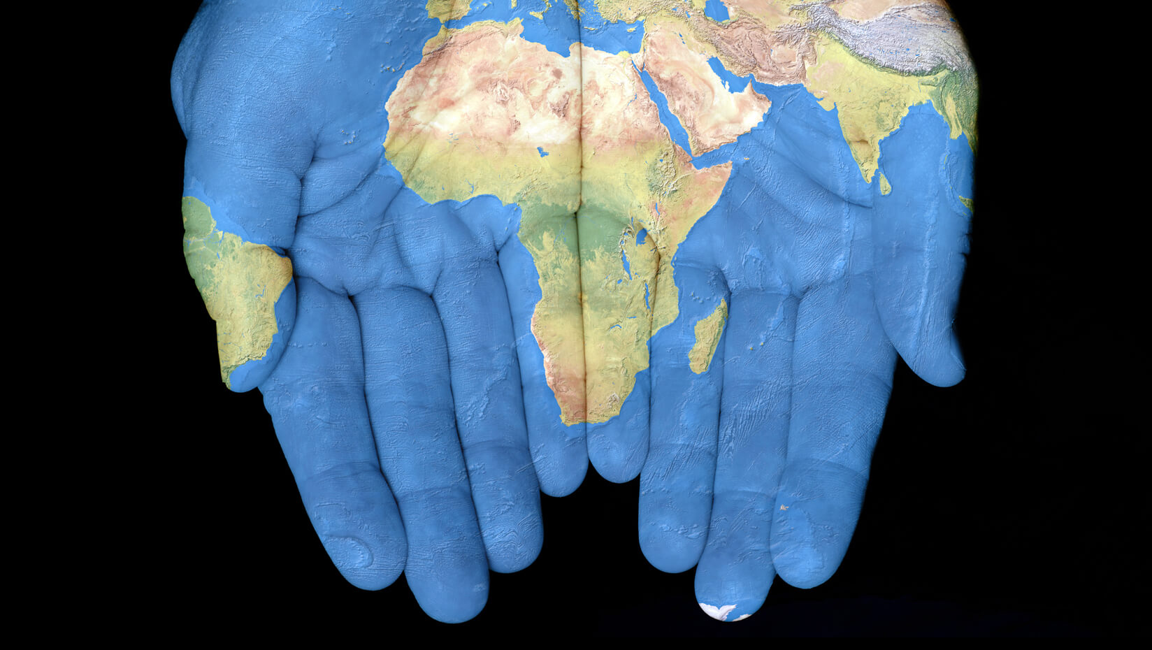 Hands showing a map of Africa