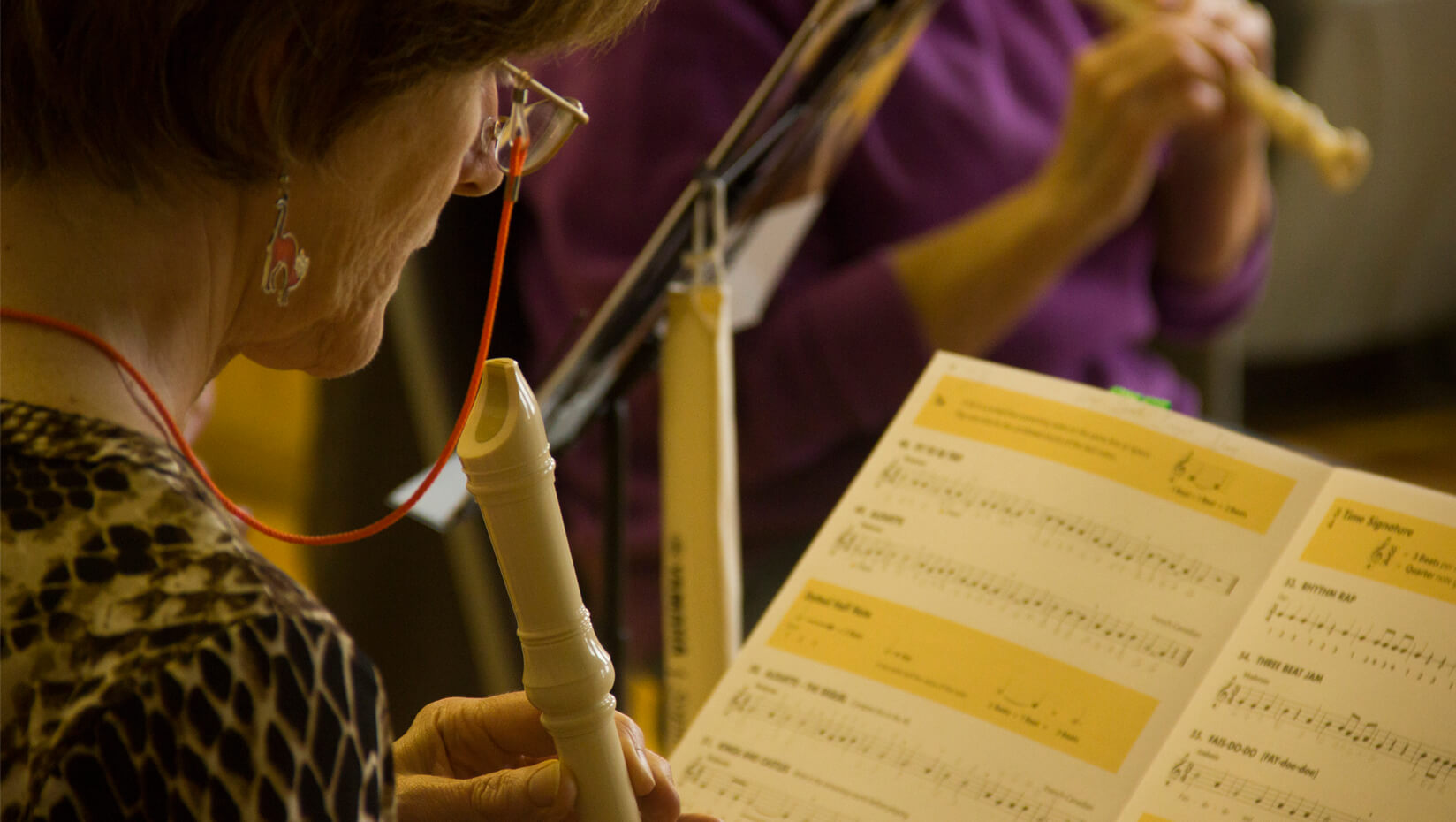 Woman playing a recorder