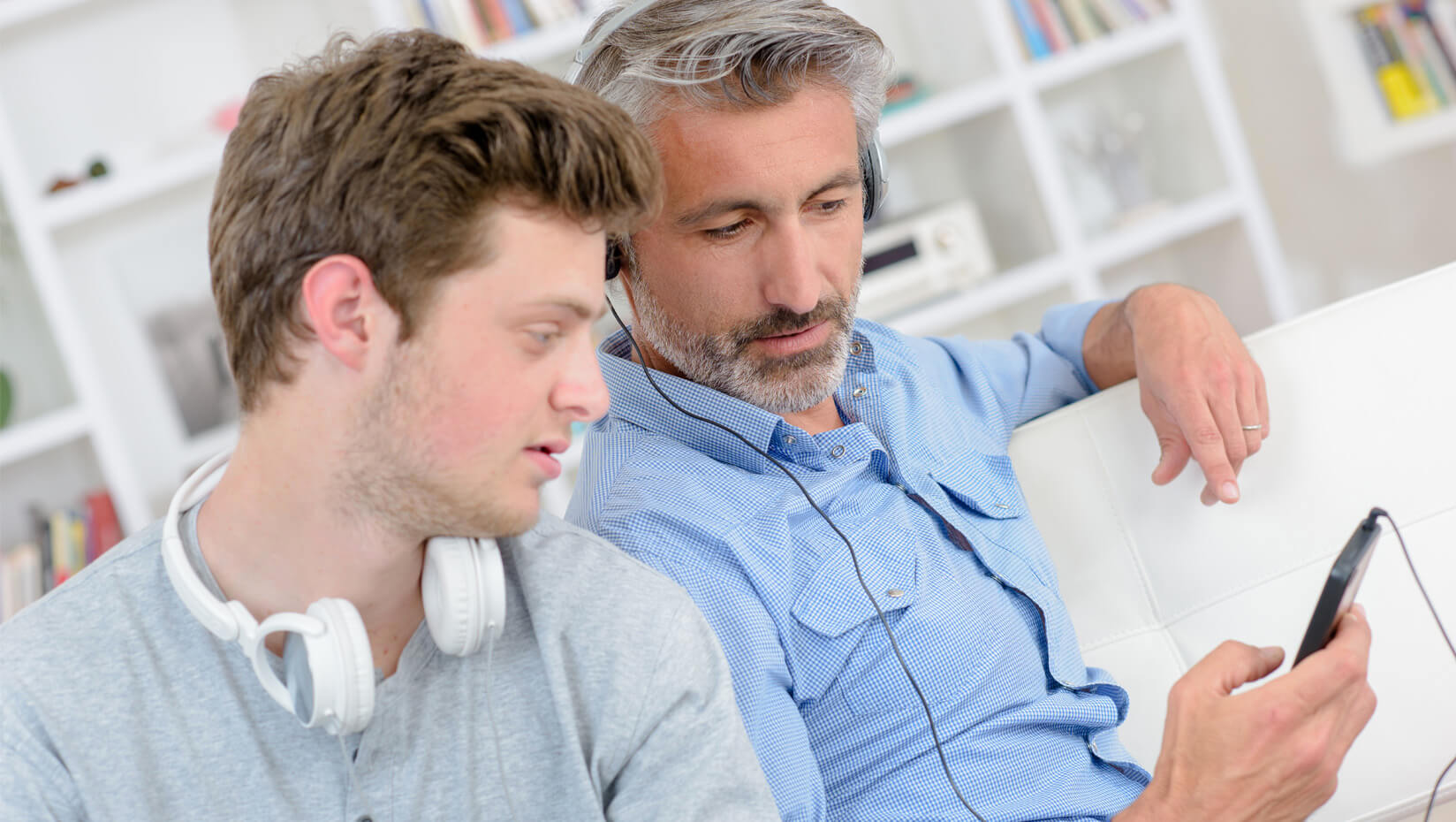 Father and son looking at a cellphone