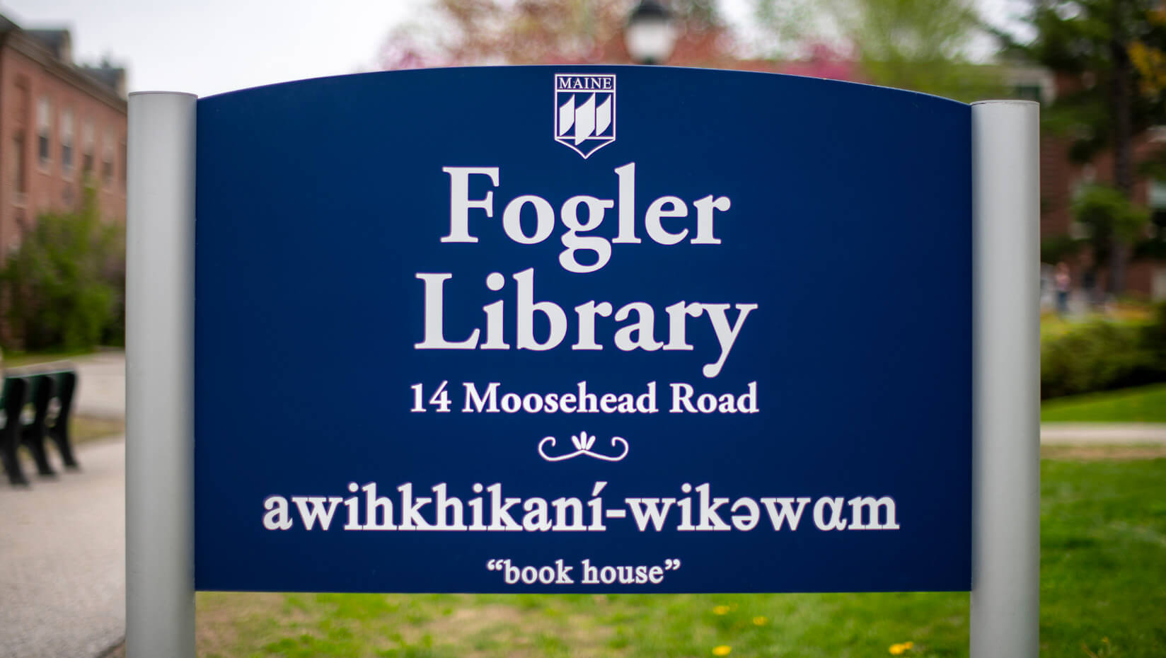 Fogler Library sign, with the library name in Penobscot and English