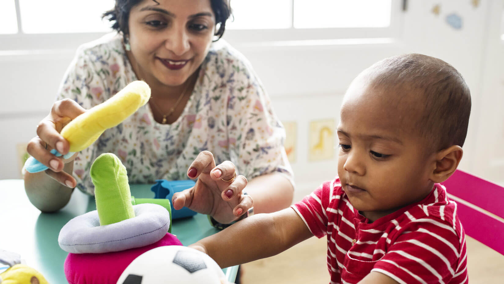 Child playing with a caregiver