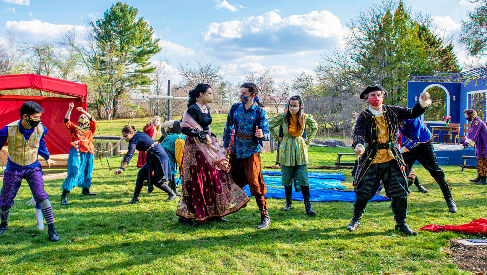 UMaine students perform in a garden on campus.