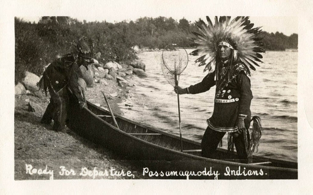 Two Native Americans in a canoe