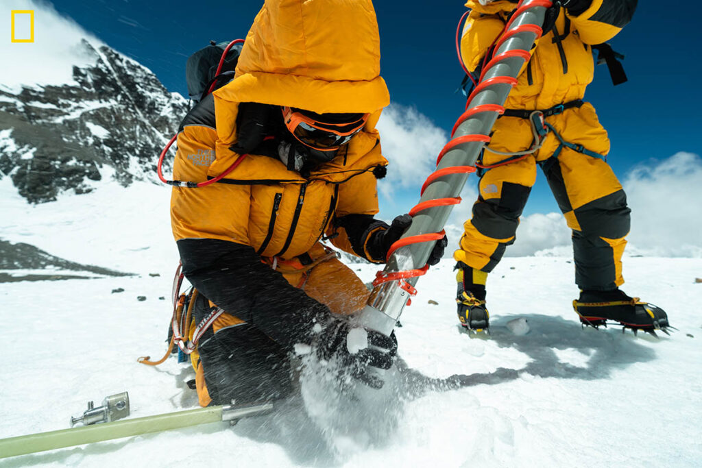 A photo of scientists drilling an ice core on Mount Everest