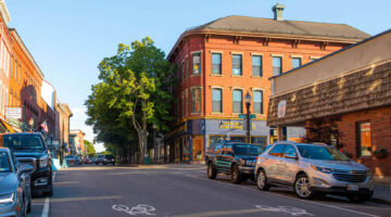 A photo of a street lined with businesses in Maine