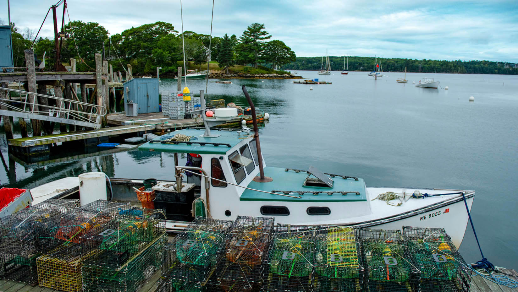 A photo of a lobster boat at a pier