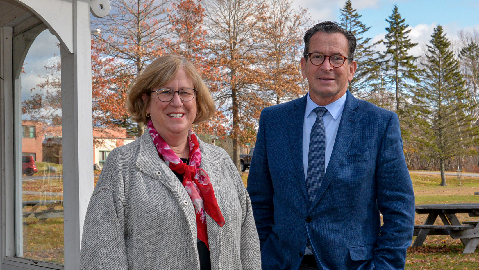 Photo of University of Maine President Joan Ferrini-Mundy (left) and University of Maine System Chancellor Dannel Malloy standing outside.