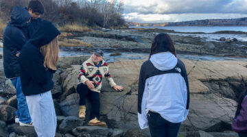 People standing on the coastline of Maine