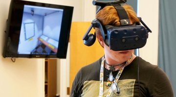 A photo of a student using a virtual reality headset