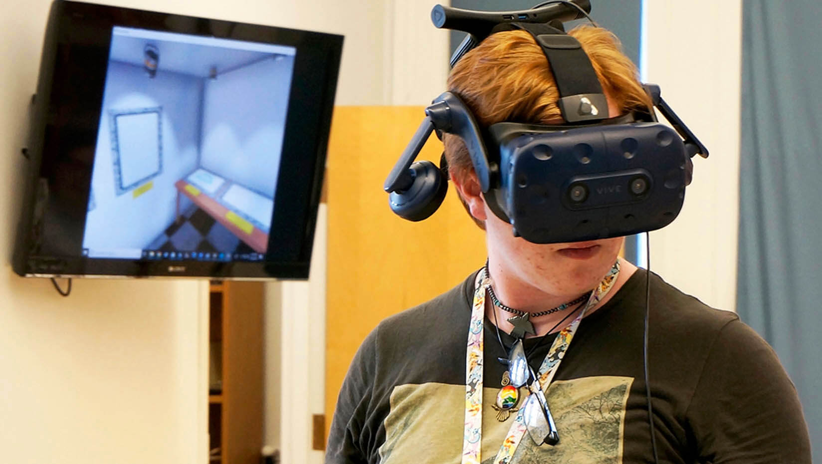 A photo of a student using a virtual reality headset