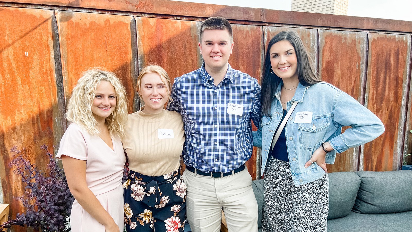 A photo of four Bangor Savings Bank management trainees— Allison Treat, Sierra Dorney, Braden Soule, and Emily Colter