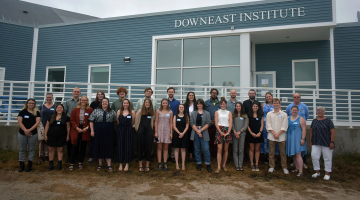 A group Sea Fellows students stand outside of the Downeast Institute in Beals, Maine.