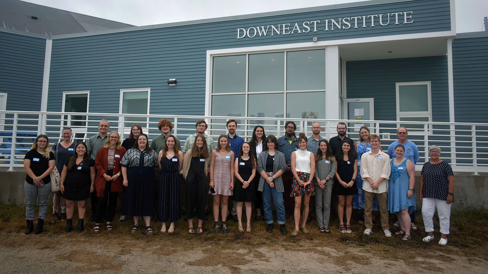 A group Sea Fellows students stand outside of the Downeast Institute in Beals, Maine.