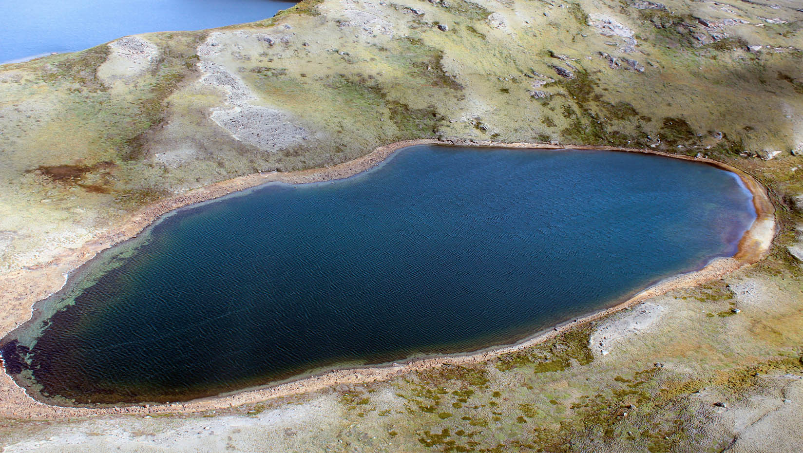 A photo of an Arctic lake in West Greenland, with noticeable decline in lake level