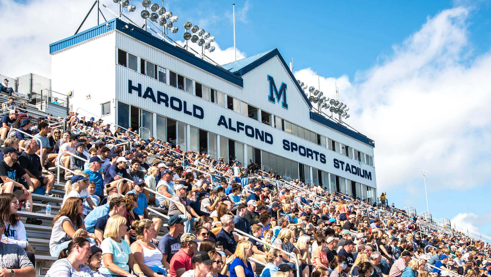 Students sit in the Harold Alfond Sports Arena during a game.