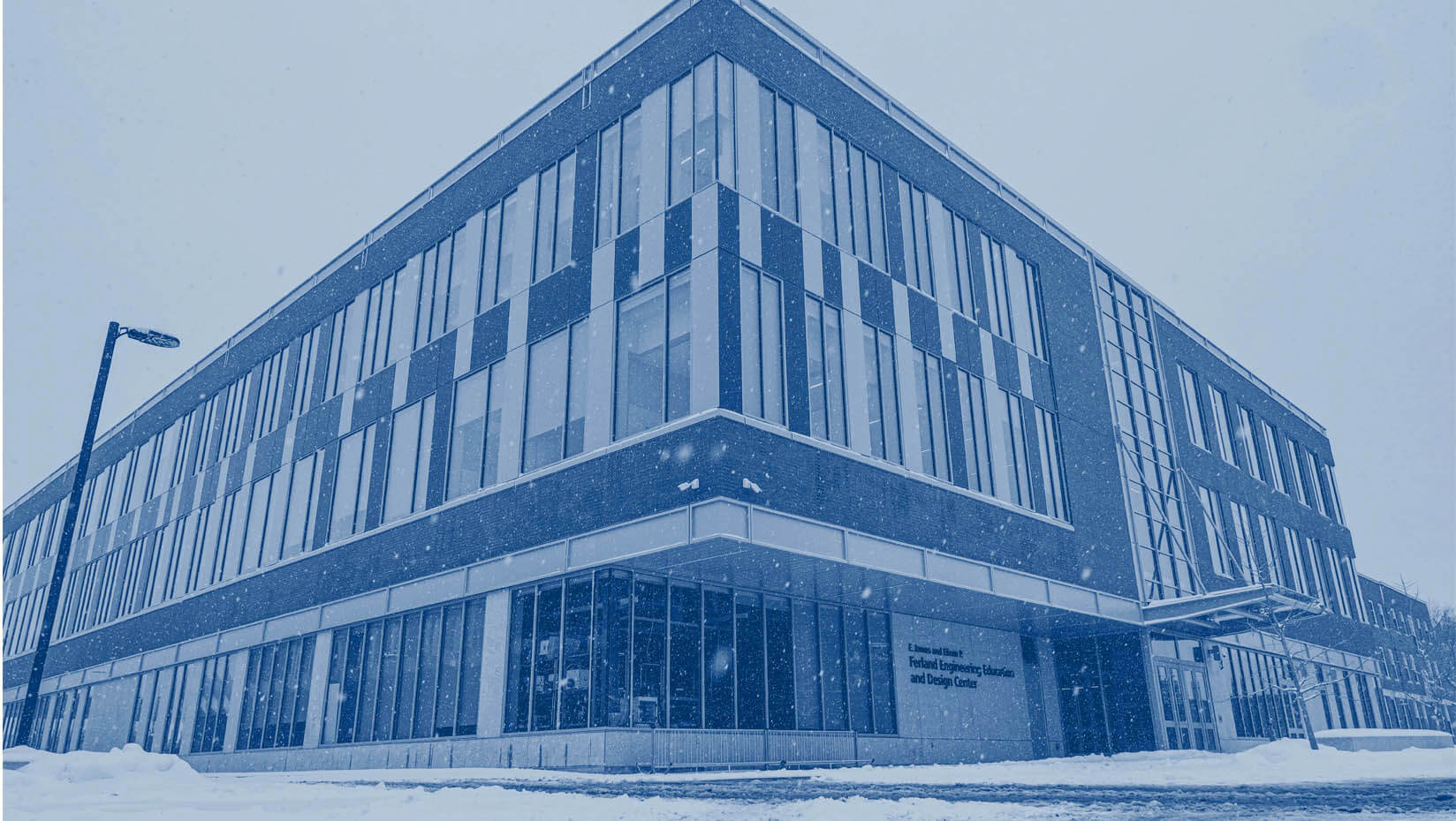 A photo of UMaine's Ferland Engineering Education and Design Center in winter