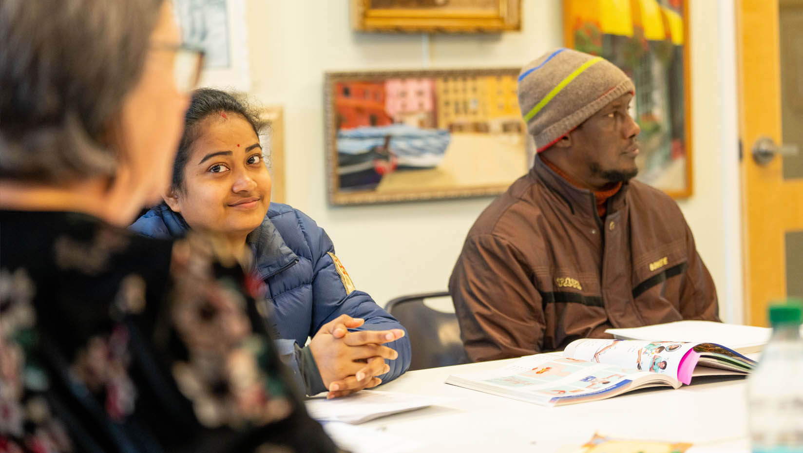 A photo of two people participating in a Community English meeting